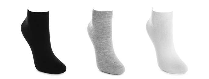 Image of Set with different socks on white background. Banner design