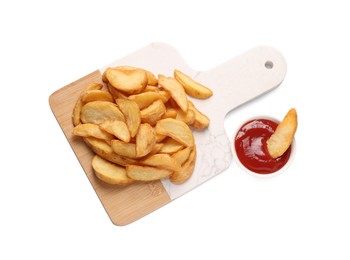 Delicious baked potato wedges and ketchup in bowl on white background, top view