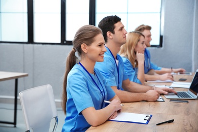 Medical student with groupmates studying in university