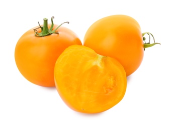 Photo of Delicious ripe orange tomatoes on white background