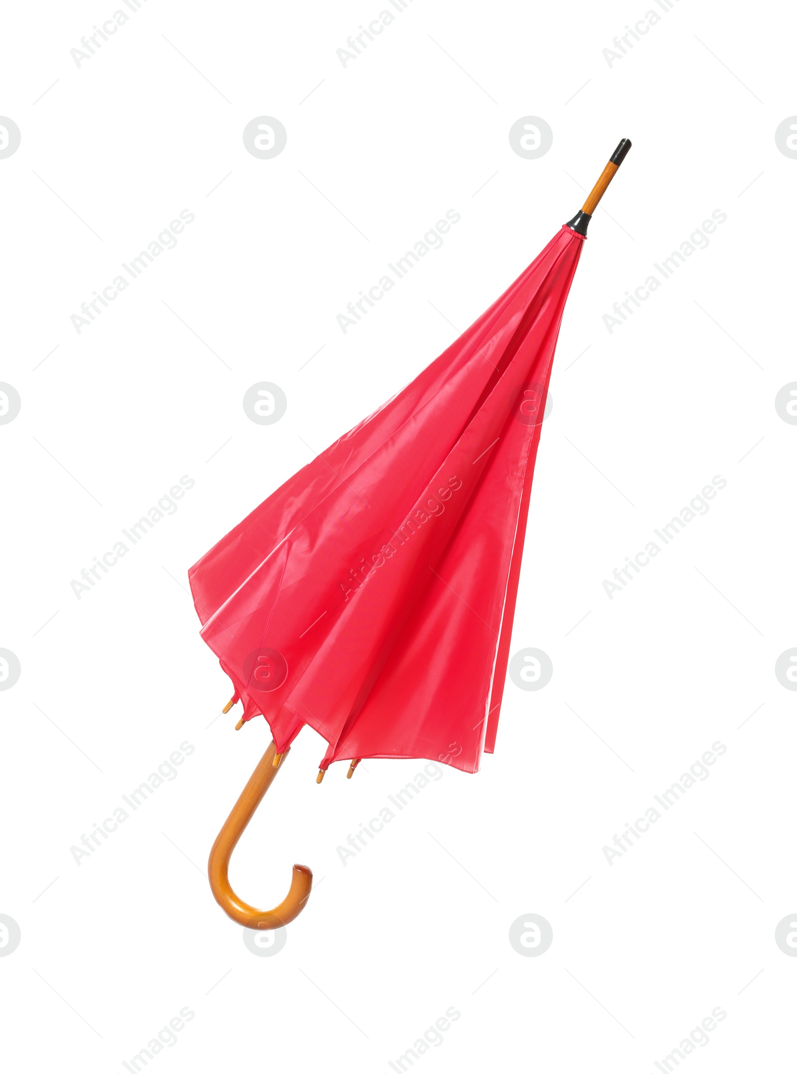 Photo of Modern closed red umbrella isolated on white