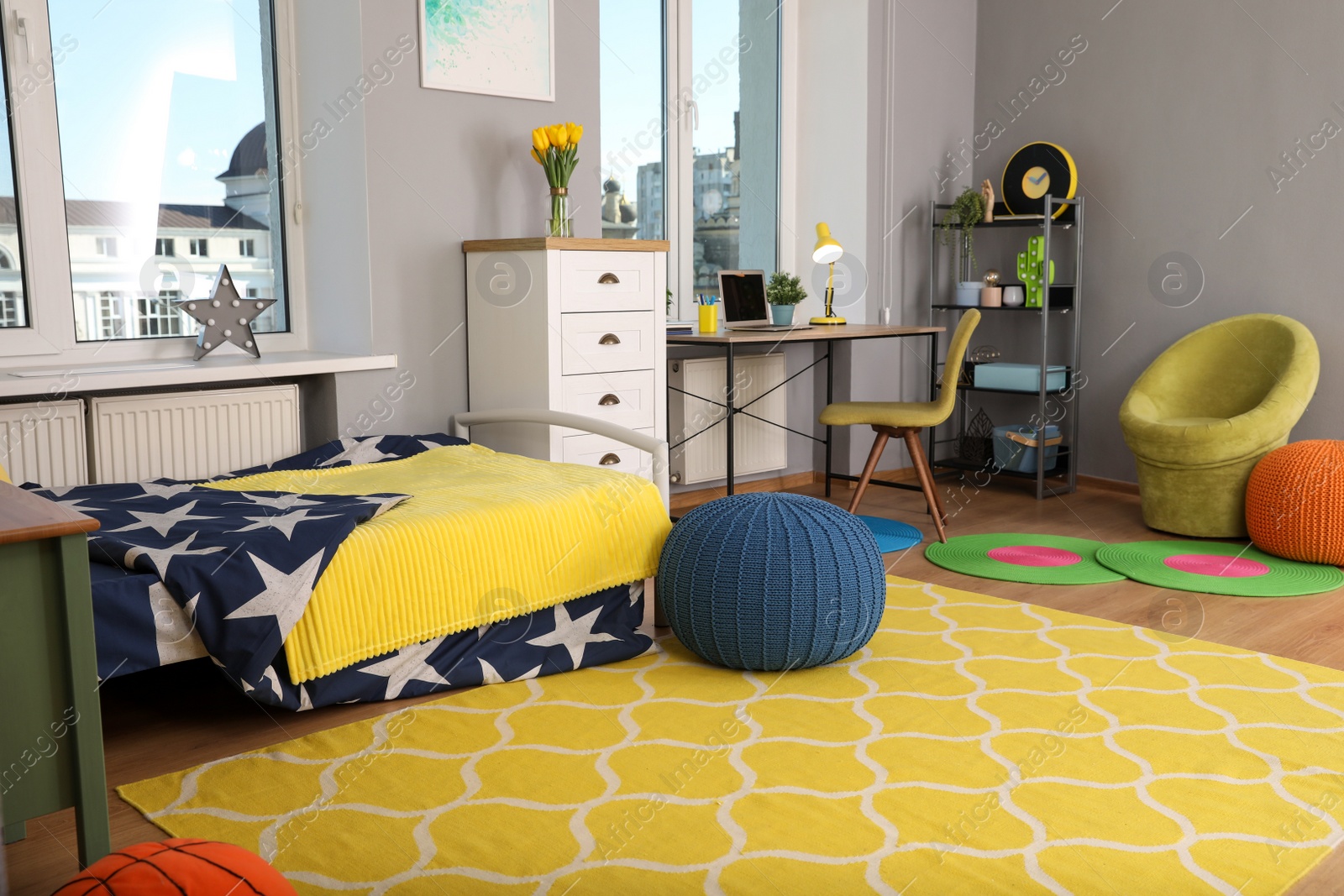 Photo of Stylish child room interior with comfortable bed and workplace