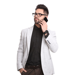 Photo of Young businessman talking on smartphone against white background