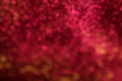 Photo of Blurred view of pink glitter as background. Bokeh effect