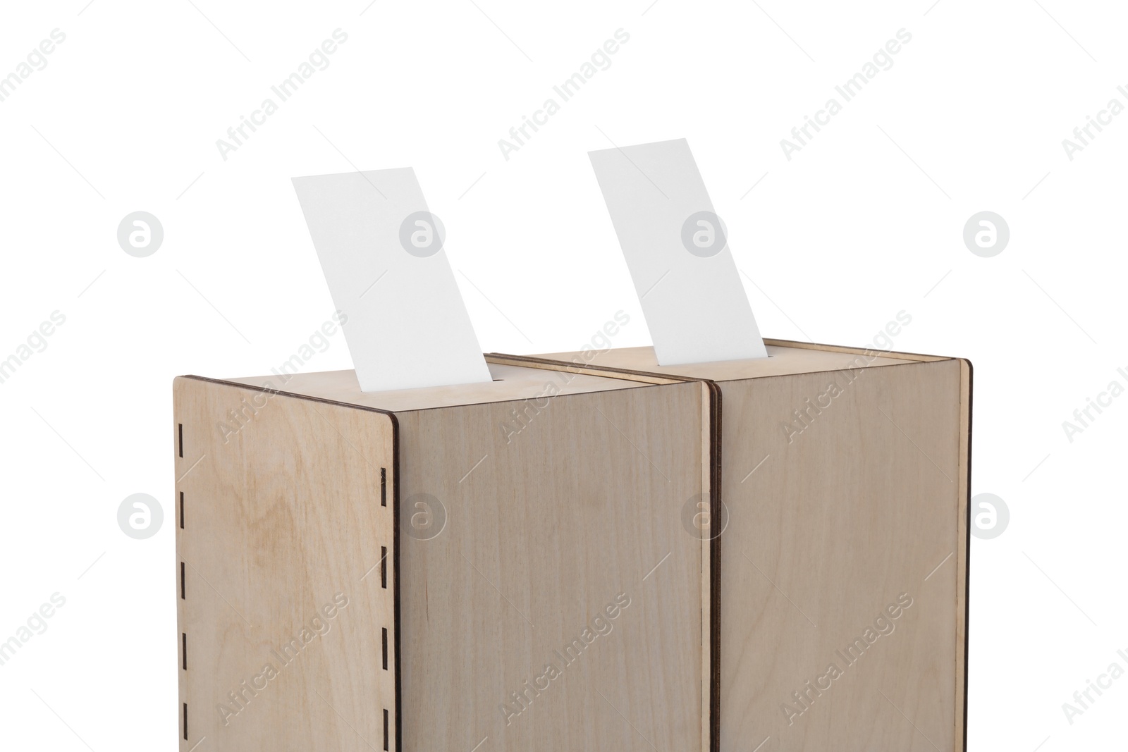 Photo of Wooden ballot boxes with votes isolated on white