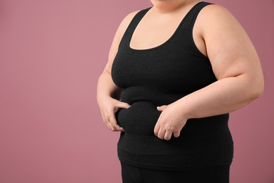 Photo of Overweight woman on color background