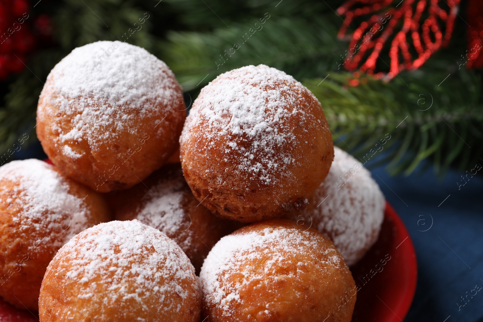 Photo of Delicious sweet buns with powdered sugar on table, closeup