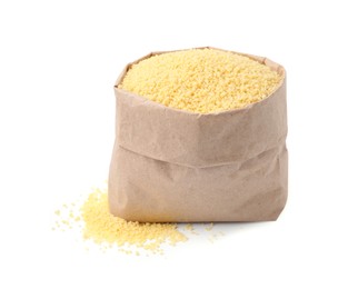 Photo of Raw couscous in paper bag isolated on white