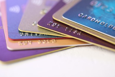 Photo of Plastic credit cards on table, closeup view