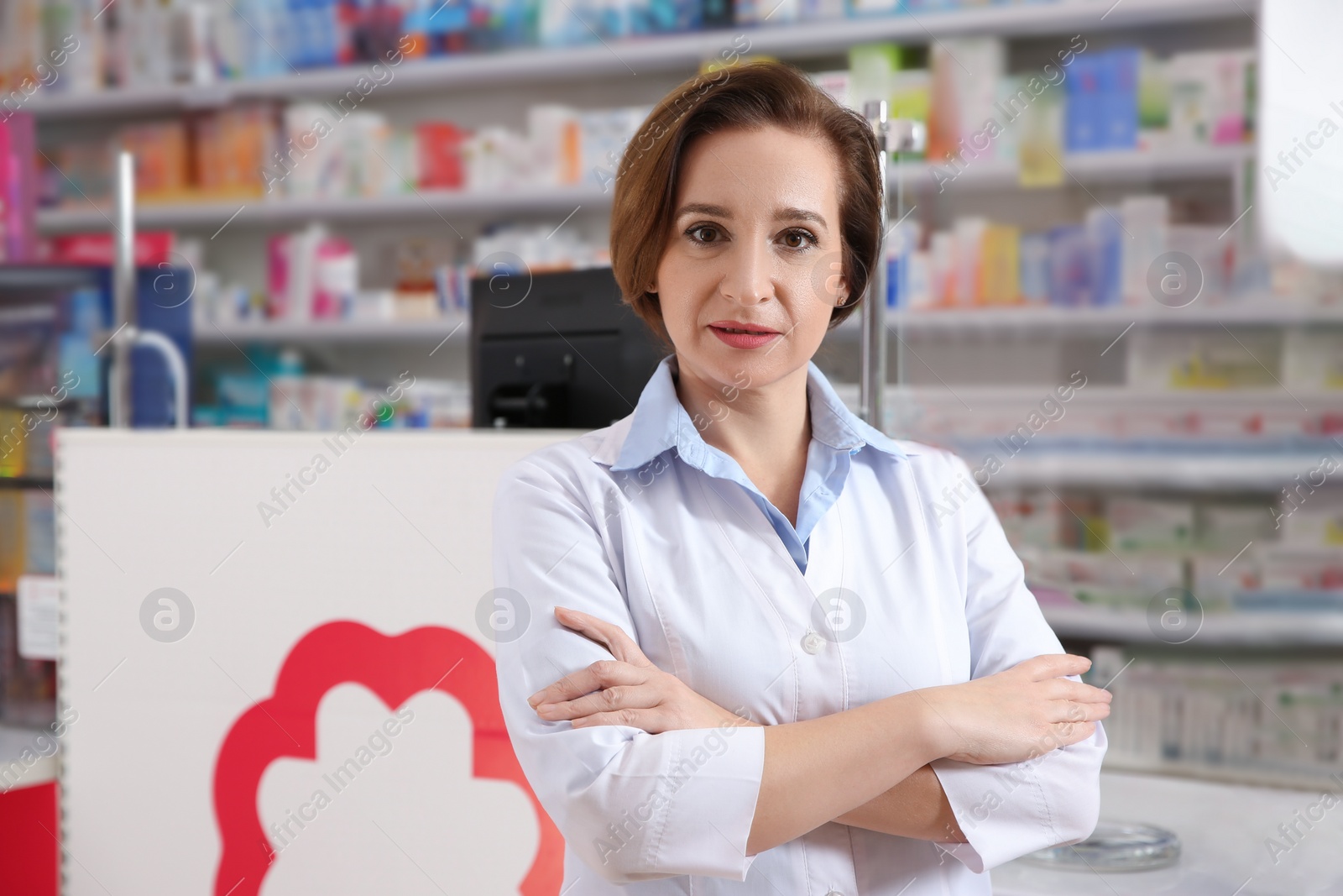 Photo of Portrait of professional pharmacist in modern drugstore