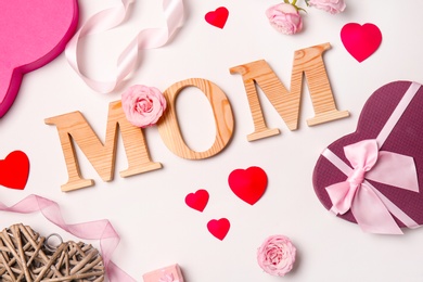 Beautiful composition with word "MOM" on white background. Happy Mother's Day