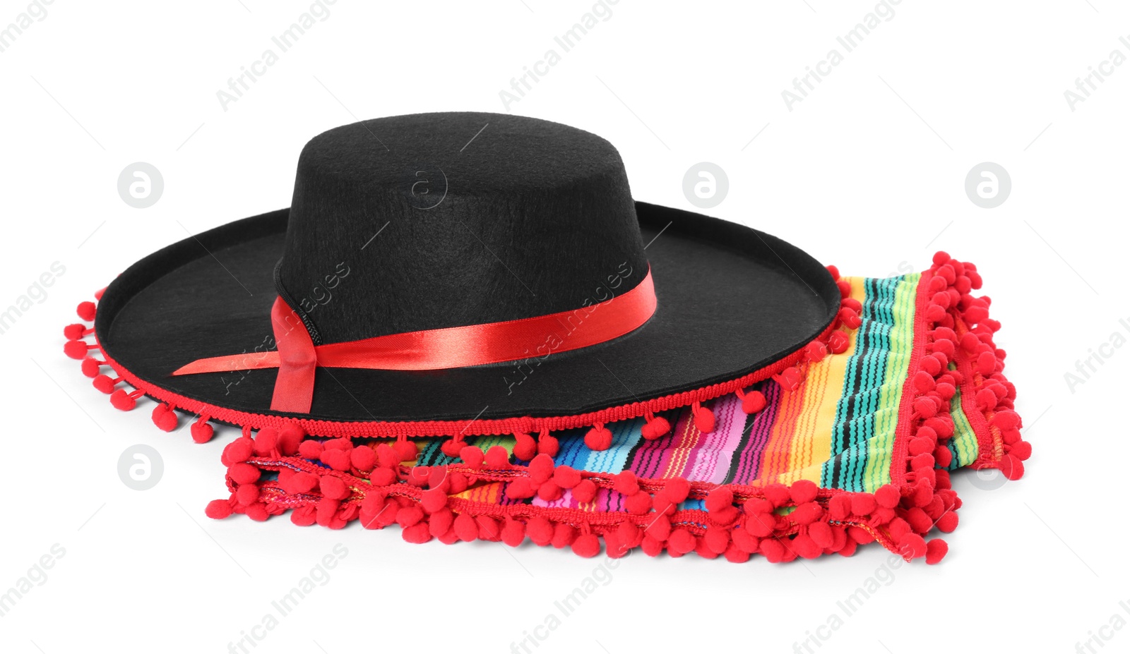 Photo of Mexican sombrero hat and colorful poncho isolated on white