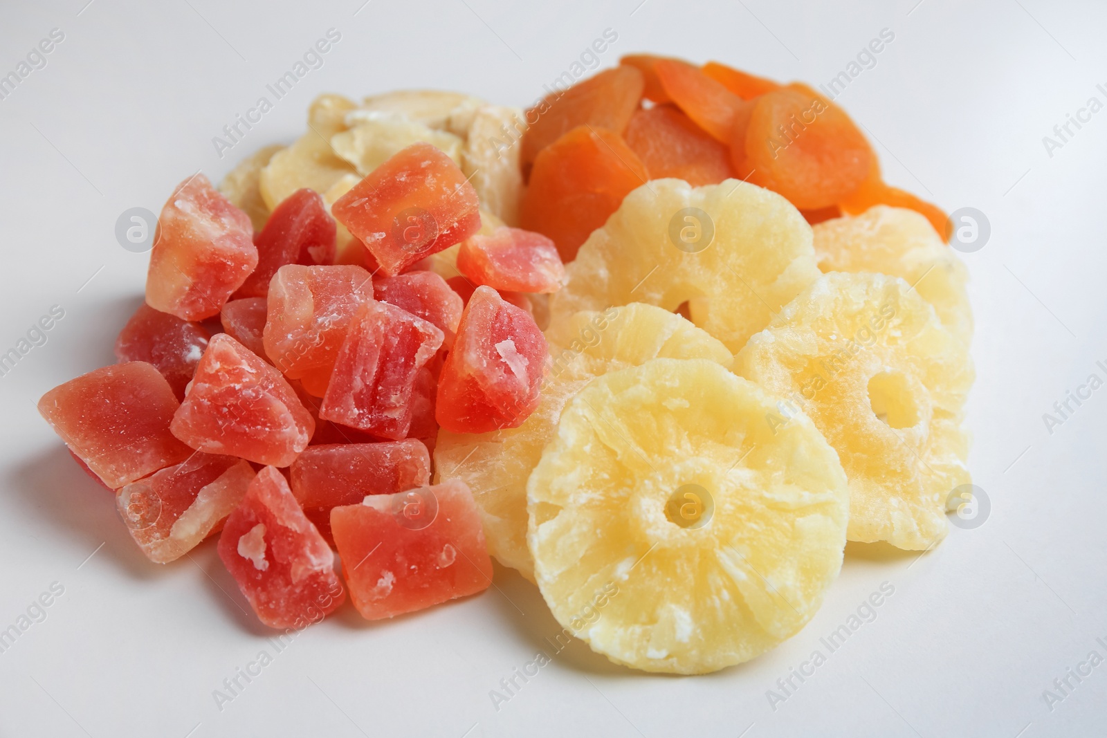 Photo of Pile of different dried fruits on white background