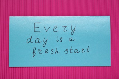 Card with phrase Every Day Is A Fresh Start on pink background, top view. Motivational quote