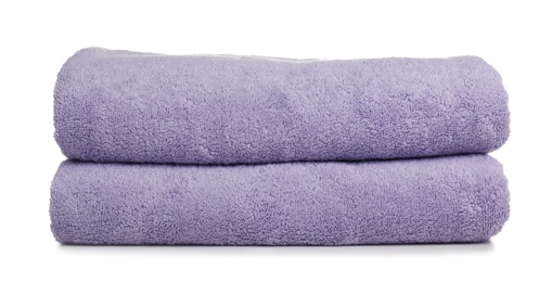 Photo of Folded soft terry towels on white background