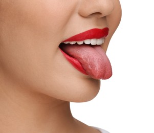 Woman showing her tongue on white background, closeup
