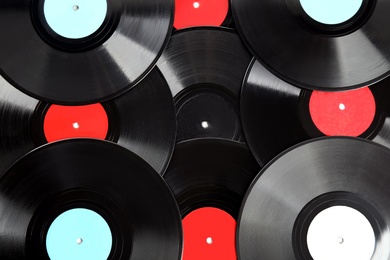 Vintage vinyl records as background, closeup view