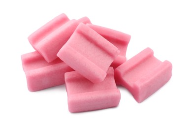 Photo of Pile of tasty pink chewing gums on white background