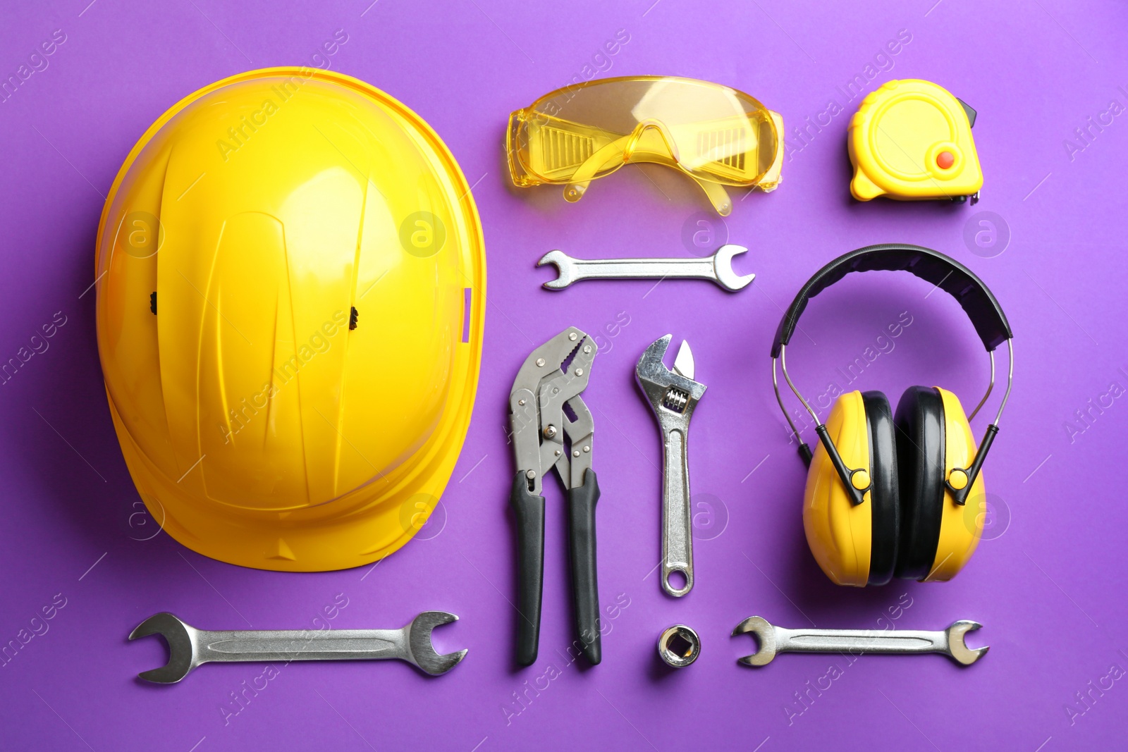 Photo of Flat lay composition with different construction tools on color background