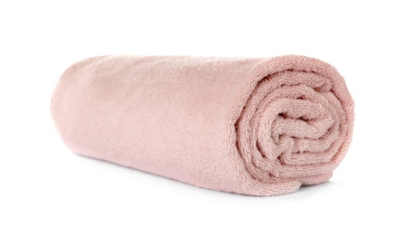 Photo of Rolled clean pink towel on white background