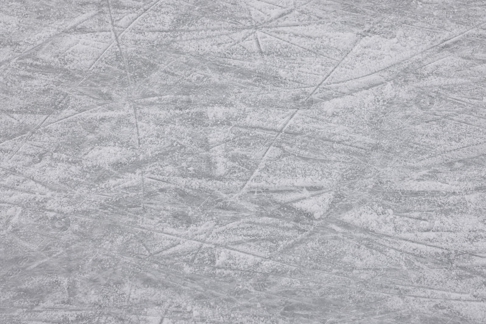 Photo of Frozen ice skating surface as background. Winter season