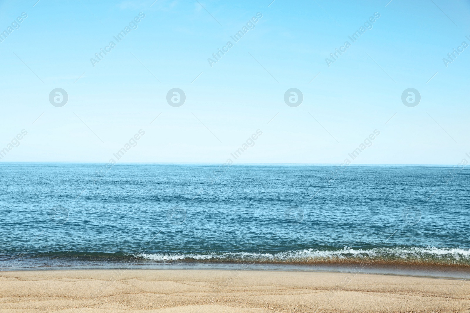 Photo of Picturesque view of sandy beach near sea