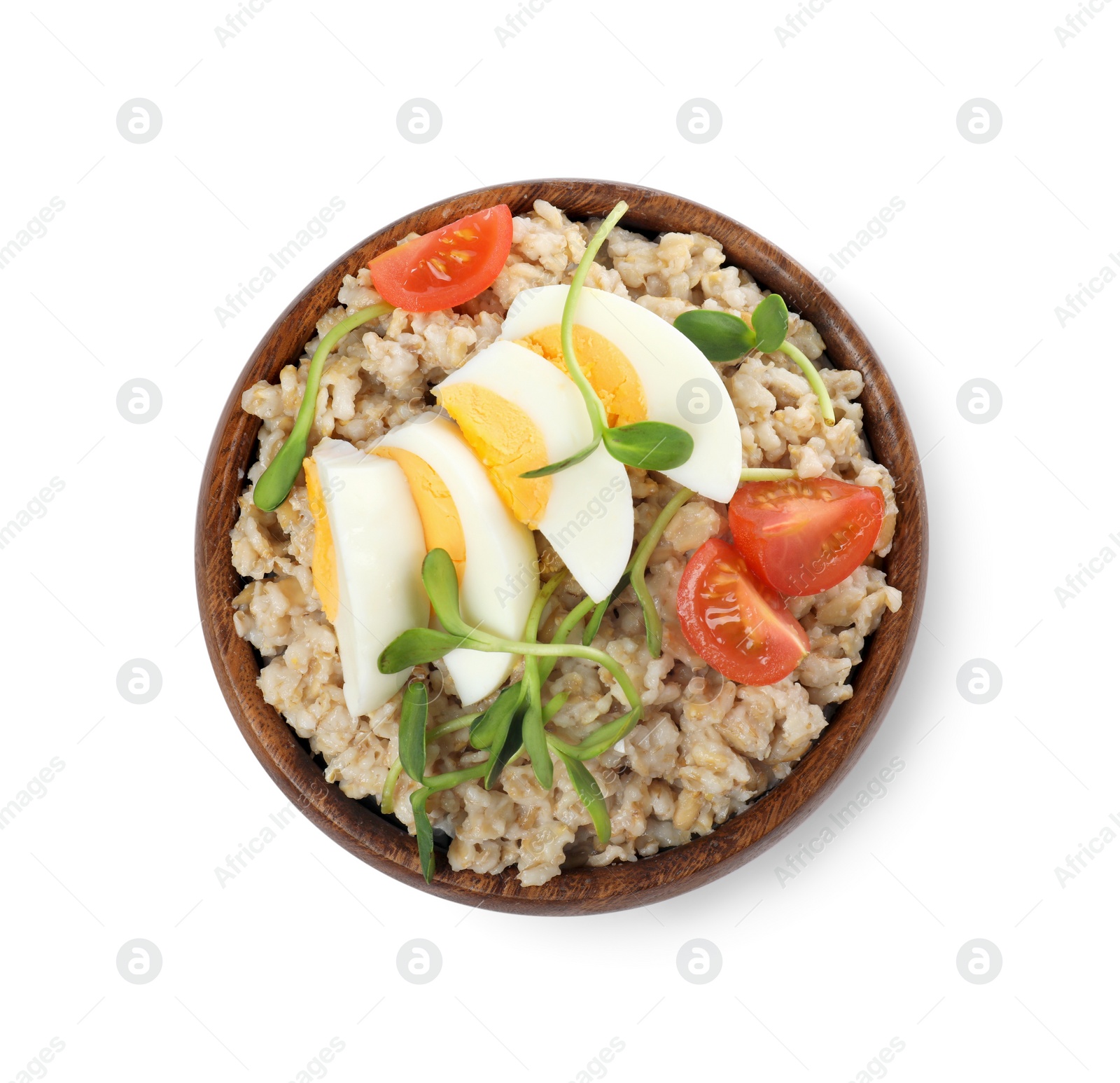 Photo of Tasty boiled oatmeal with egg, tomatoes and microgreens isolated on white, top view