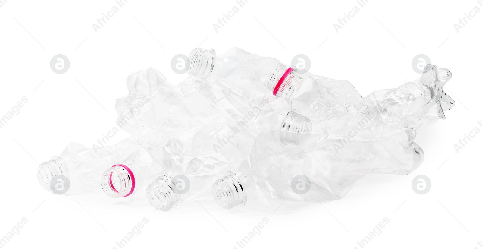 Photo of Crumpled disposable plastic bottles on white background