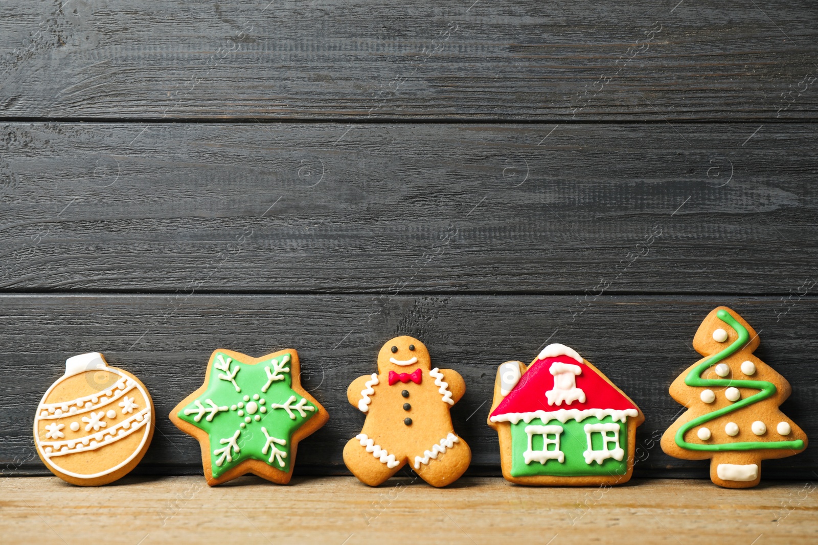 Photo of Tasty homemade Christmas cookies on table, space for text