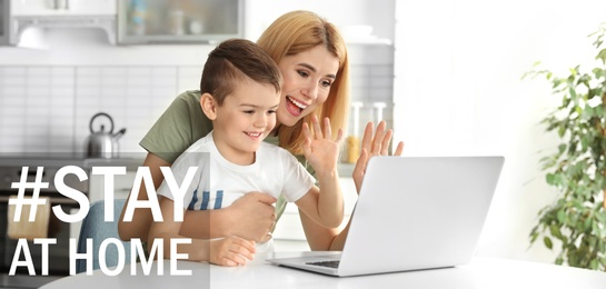 Image of Hashtag Stay At Home - protective measure during coronavirus pandemic, banner design. Mother and her son using video chat on laptop at table in kitchen