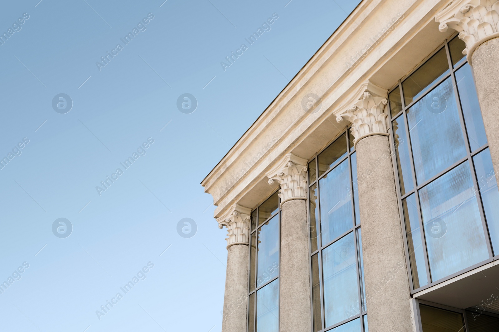 Photo of Supreme court building with pillars. Law and justice