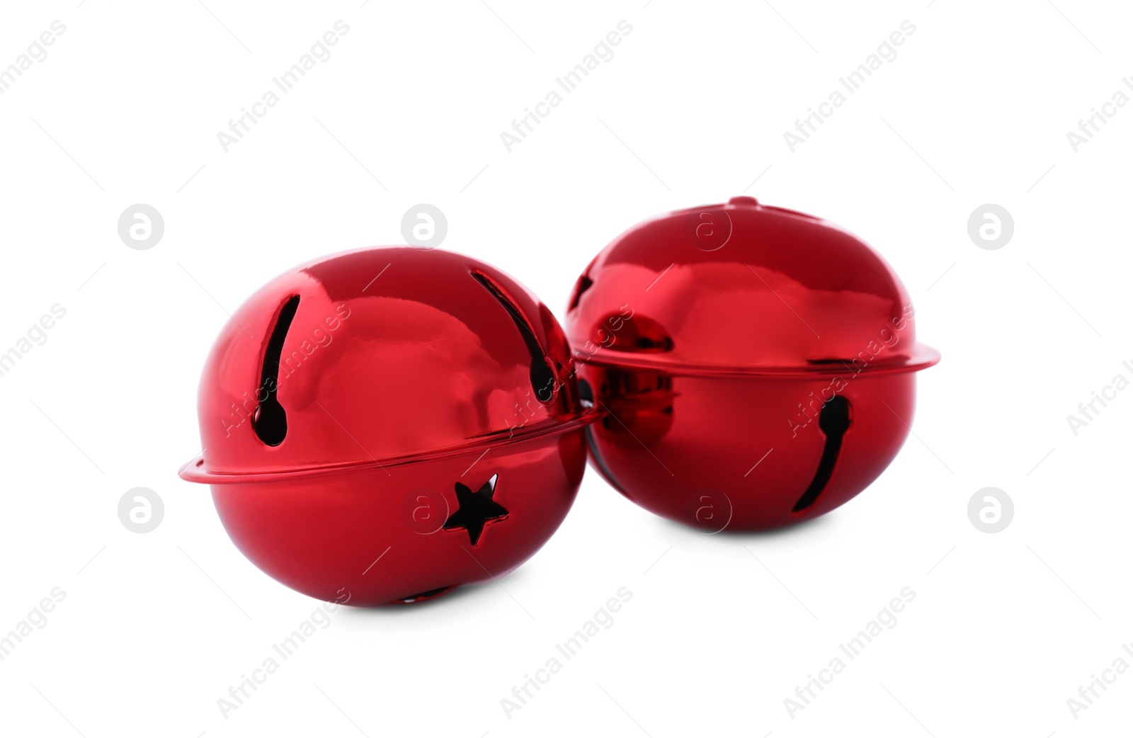 Photo of Shiny red sleigh bells isolated on white