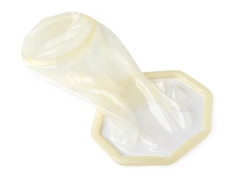 Photo of Unrolled female condom isolated on white. Safe sex