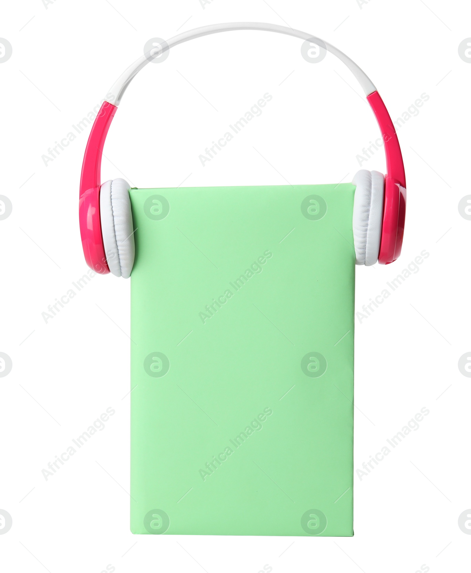 Photo of Book with blank cover and headphones isolated on white