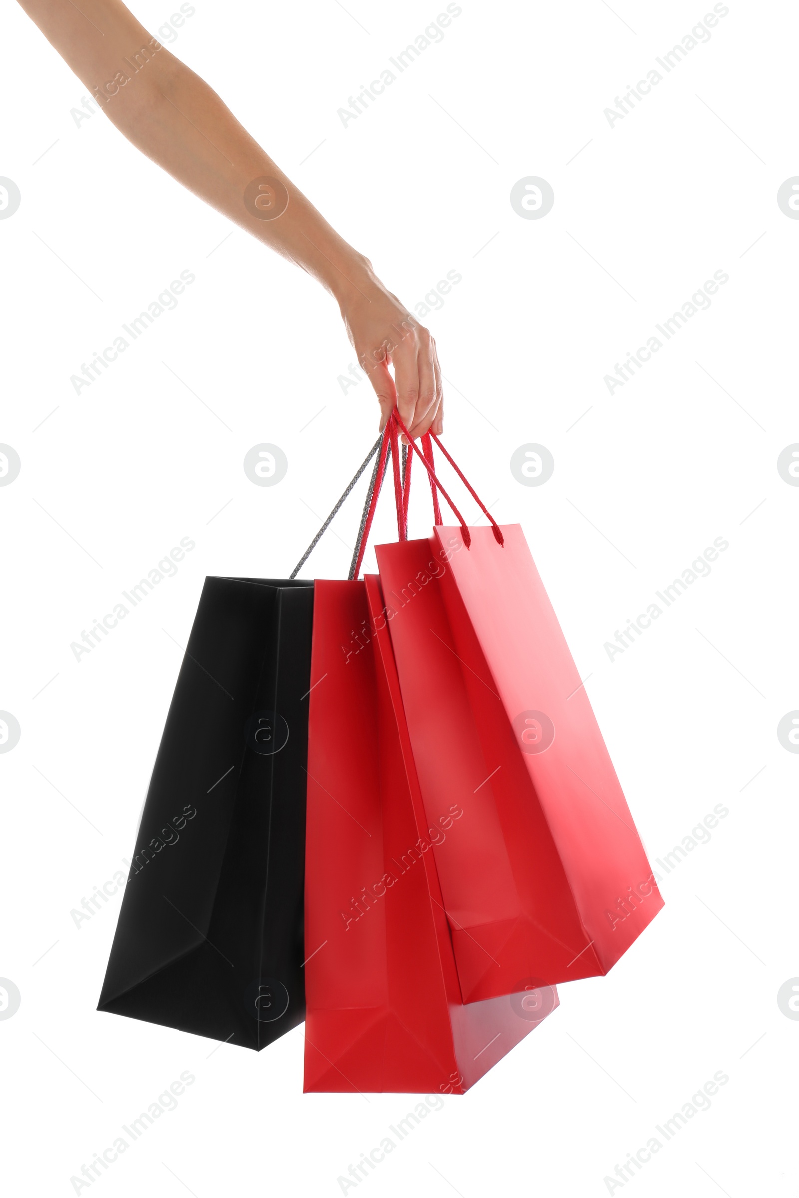 Photo of Woman with paper shopping bags on white background, closeup