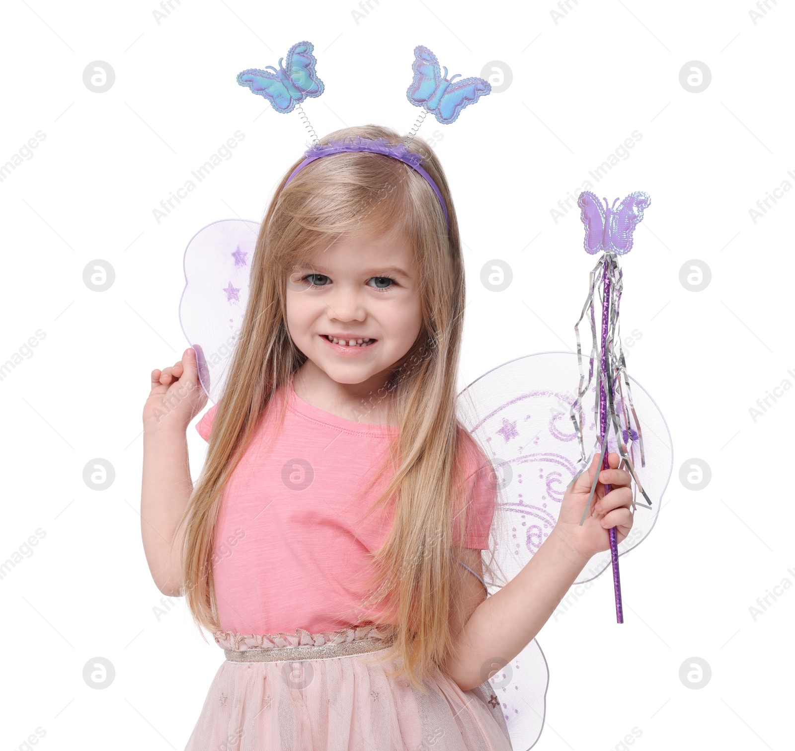 Photo of Cute little girl in fairy costume with violet wings and magic wand on white background