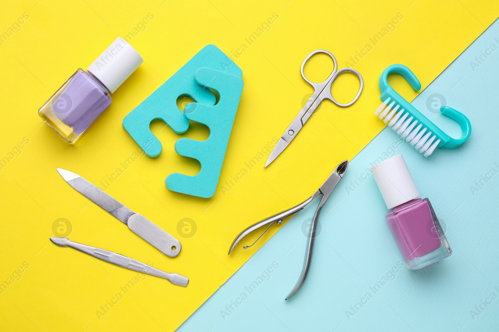 Photo of Set of pedicure tools on color background, flat lay