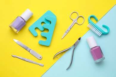 Set of pedicure tools on color background, flat lay
