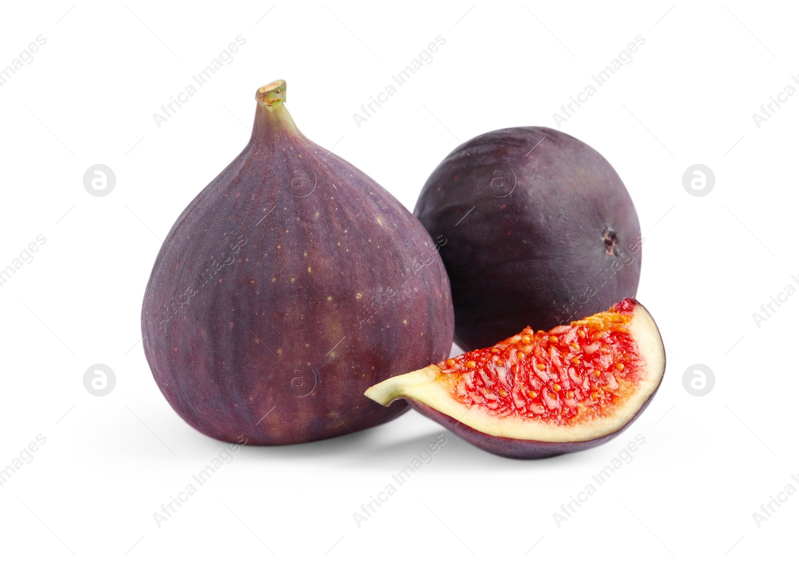 Photo of Cut and whole ripe figs isolated on white