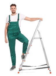 Worker in uniform near metal ladder on white background