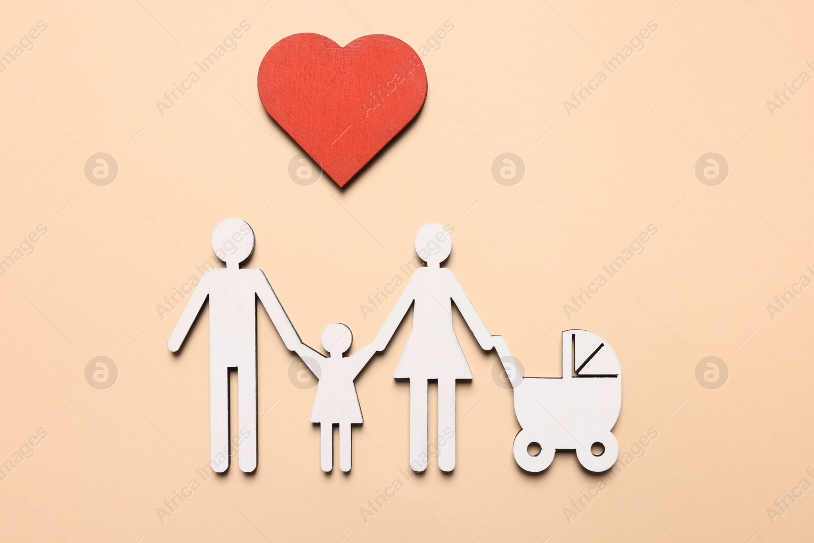 Photo of Figures of family and heart on beige background, top view. Insurance concept