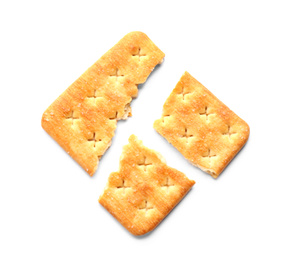 Broken delicious crispy cracker isolated on white, top view