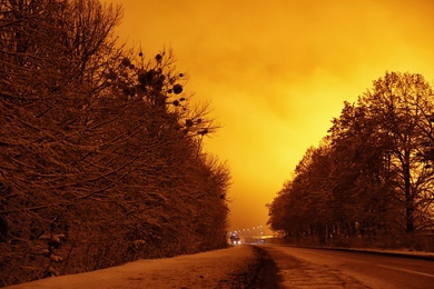 Beautiful view of twilight over country road. Winter landscape