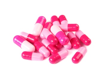 Photo of Pile of color pills on white background