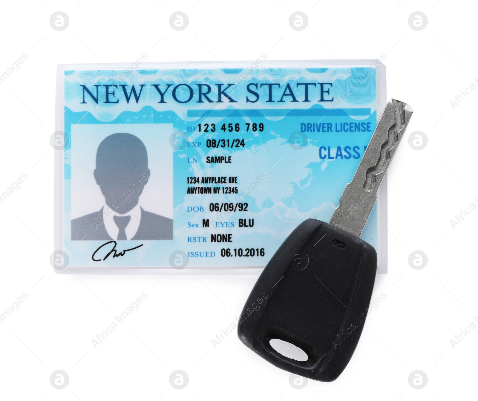 Photo of American driving license and car key on white background, top view