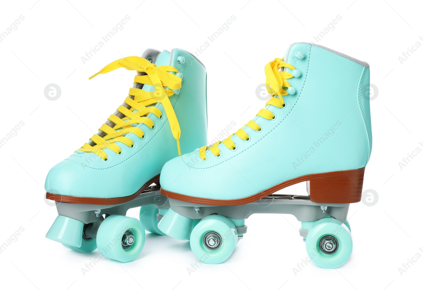 Photo of Pair of bright stylish roller skates on white background