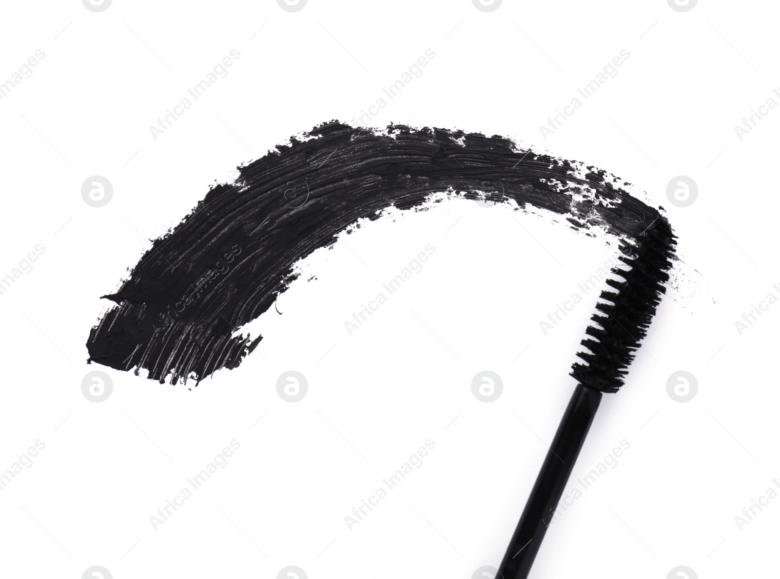 Photo of Applicator and black mascara smear on white background, top view