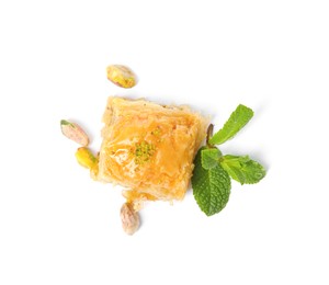 Delicious baklava with pistachios, mint and scattered nuts on white background, top view