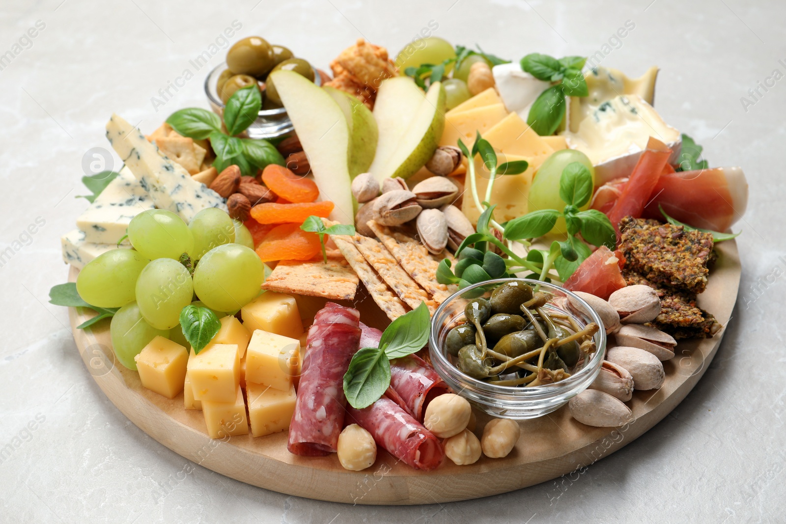 Photo of Different tasty appetizers on light table, closeup