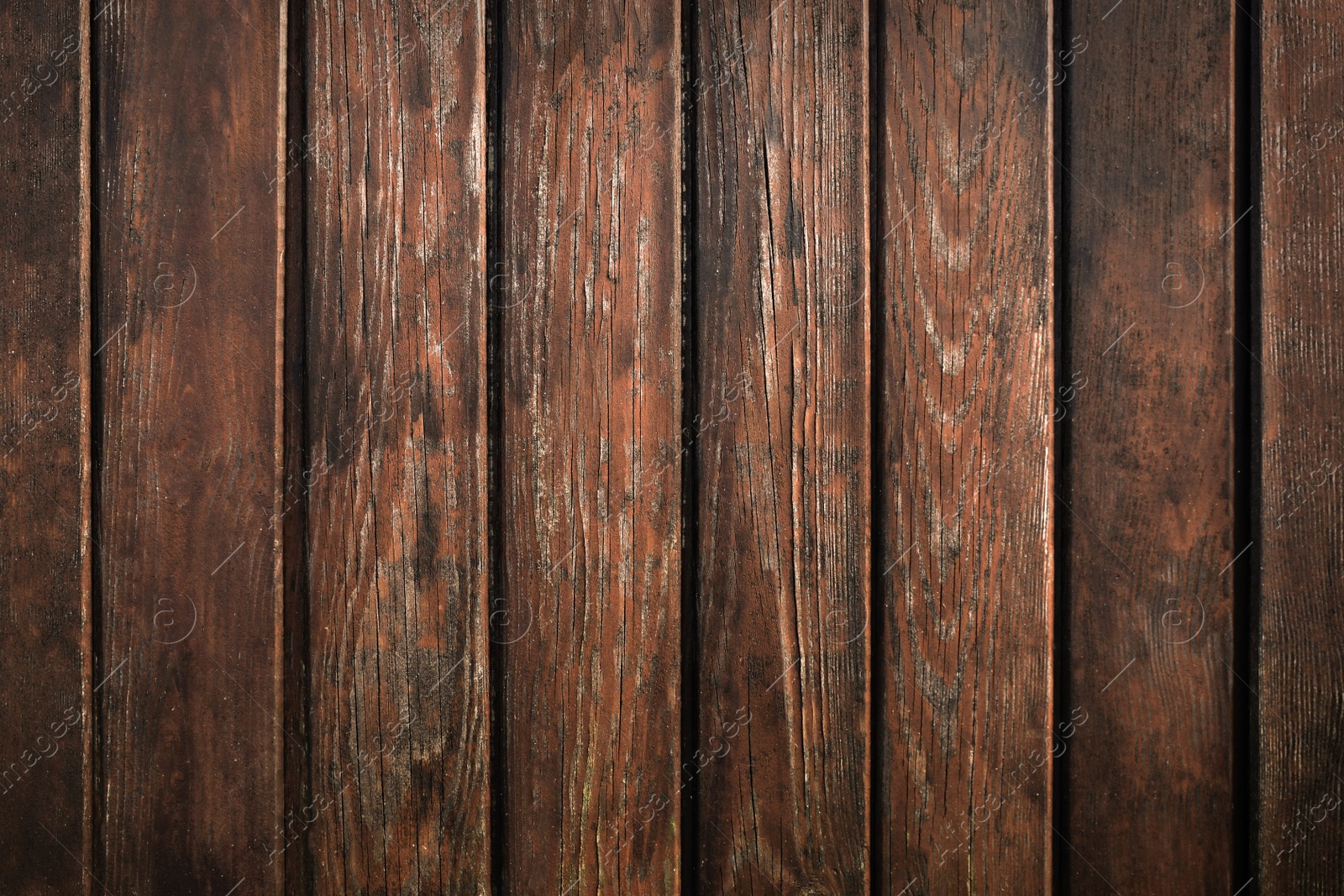 Photo of Texture of brown wooden planks as background